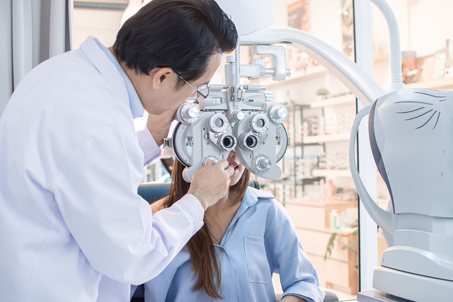 eye test by Ophthalmologist in optical lab.